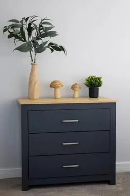 a black dresser with two vases and a plant on it at Charming Terrace House for Relaxing Retreat in Dumbarton