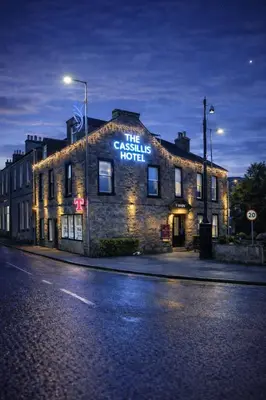 a brick building with a sign that reads the castle hotel at The Cassillis Hotel - Smart Self Check-in Hotel & Bar in Maybole