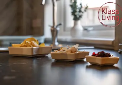a counter with two plates of food on a table at Orbiston House by Klass Living Bellshill in Bellshill