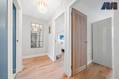 an empty hallway with a door leading to a bedroom at 3Bed Home Sleeps 6 w Private Parking in Dunfermline