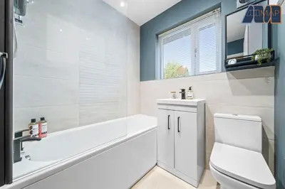 a bathroom with a tub and a toilet and a sink at 3Bed Home Sleeps 6 w Private Parking in Dunfermline
