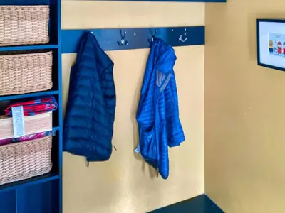 two blue umbrellas are hanging on a wall at Alt Na Blathaich in Coirantee