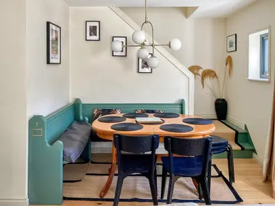 a dining room with a table and chairs at Alt Na Blathaich in Coirantee