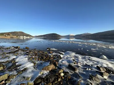 a river with snow on the shore at Traditional Inveraray Cottage - Amazing Loch Views in Inveraray