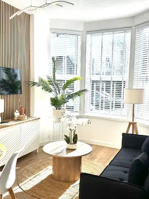 a living room with a couch and a coffee table at Castlegreen Lux Apartment in Dumbarton