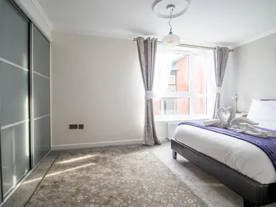 a bedroom with a bed and a window at Metropolitan St Andrews Cathedral View - Pass the Keys in Glasgow