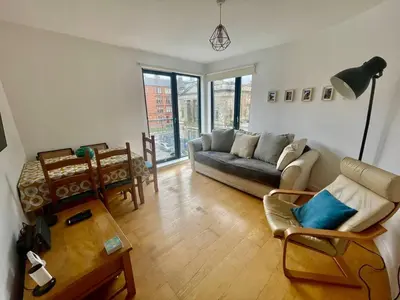 a living room with a couch and a table at Perfect Location in Heart of Glasgow West End - Pass the Keys in Glasgow