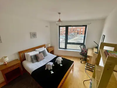a bedroom with a bed with two stuffed animals on it at Perfect Location in Heart of Glasgow West End - Pass the Keys in Glasgow