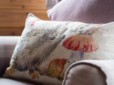 a pillow sitting on a couch with a mushroom at Chalet Loch Leven Lodge 21 by Interhome in Kinross