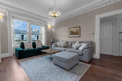 a living room with a couch and a table at GuestReady - Charming home in Edinburgh in Edinburgh
