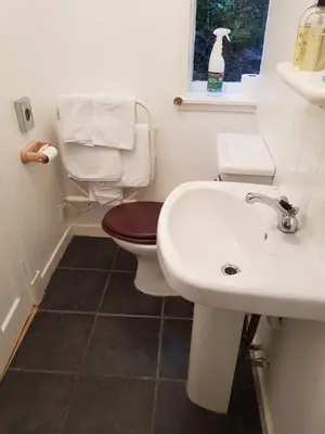 a bathroom with a toilet and a sink at Maridon House in Oban