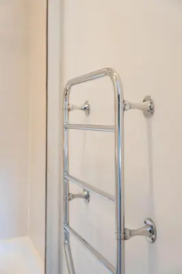 a glass shower door with a metal towel rack at Argyle Apartment in Glasgow
