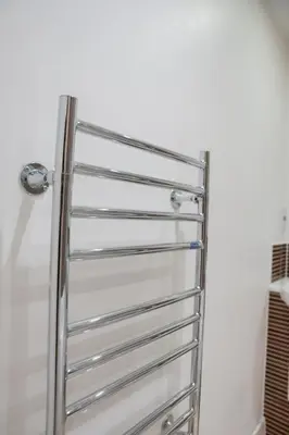 a chrome towel rack in a bathroom at Argyle Place in Glasgow