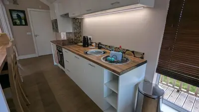a kitchen with a sink and a counter top at The Dochart Lodge with hot tub Braidhaugh Crieff in Crieff