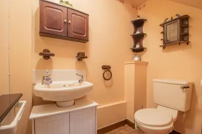 a bathroom with a toilet and a sink at Ideal Contractor Stay 2-Bed Near Glasgow Fort in Garthamlock