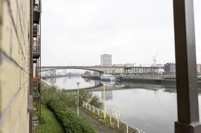 a view of a river with a bridge at Riverview House in Glasgow