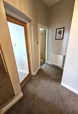 an empty room with a door and a window at Ocean View 2 in Campbeltown