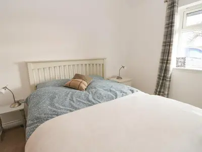 a bed with two pillows on it in a bedroom at The Old House, Balure in Oban