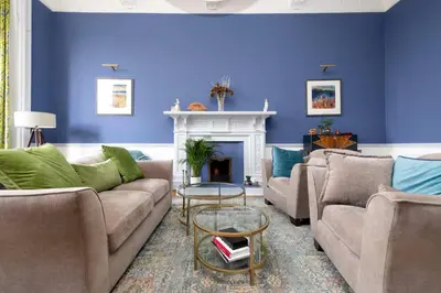 a living room with two couches and a fireplace at JOIVY Spacious 2-Bedroom Ground Floor Flat in Edinburgh