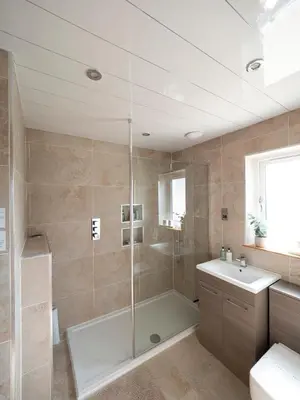 a bathroom with a shower and a tub and a sink at East Laigh Gree Bed and Breakfast in Burnhouse