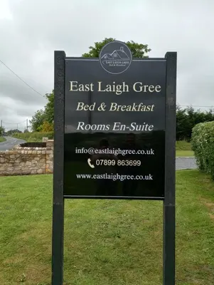 a sign for the east laith greens bed and breakfast at East Laigh Gree Bed and Breakfast in Burnhouse