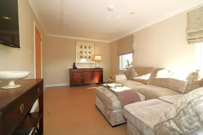 a living room with a couch and a table at Signature - Cross House in Lanark