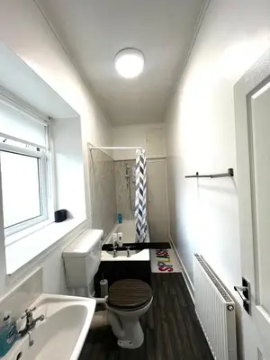 a bathroom with a toilet and a sink at Two Bedroom Apartment in Bridge of Allan in Bridge of Allan