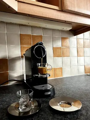 a coffee maker sitting on top of a kitchen counter at Two Bedroom Apartment in Bridge of Allan in Bridge of Allan