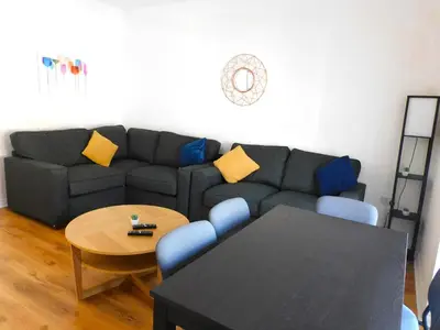 a living room with a couch and a table at No 9 - Modern 3 Bedroom Apartment in Lanark Town Centre in Lanark