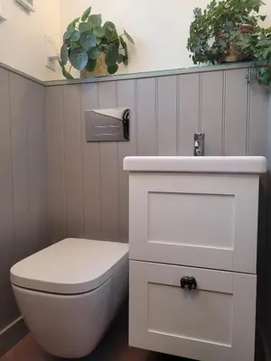 a bathroom with a toilet and a sink at Hot Tub Cottage in Ayrshire in Stewarton