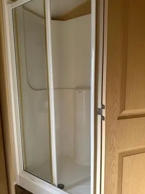 a glass door to a shower in a bathroom at Winchester 23 in Ardentinny