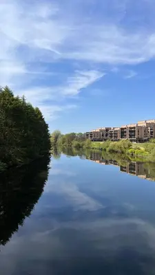 a view of a river with buildings in the background at En-suite - Glasgow Riverside in Glasgow