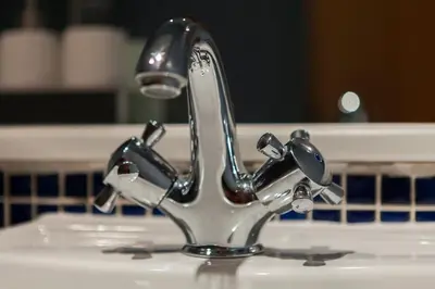 a bathroom sink with a chrome faucet at Bright & Stylish West End Apartment in Edinburgh