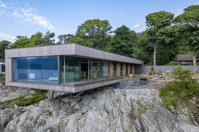 a modern house on a rocky hillside at 4 Bed in Cove oc-r31840 in Cove