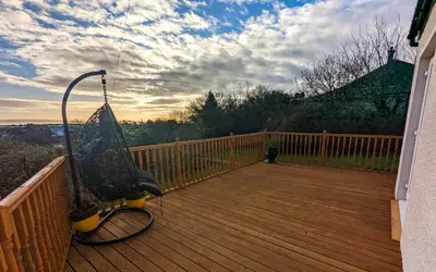 a bike parked on a wooden deck at The Old High Road, North Ayrshire in Stevenston