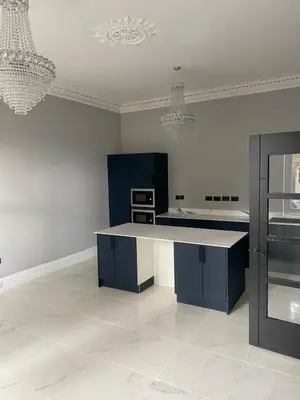 a kitchen with a blue island in a room at Central Hotel Edinburgh in Edinburgh