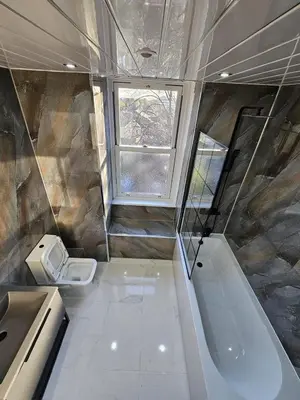 a bathroom with a toilet and a bath tub at Central Hotel Edinburgh in Edinburgh