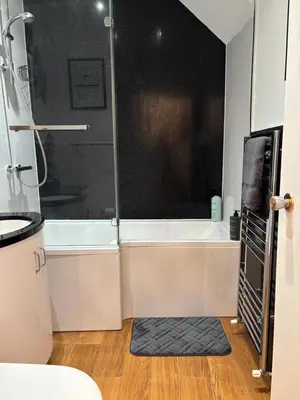 a bathroom with a shower and a bath tub at Saltayr in Ayr
