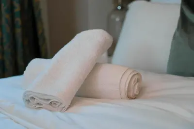 a rolled up towel on top of a bed at The Snook-Free Parking-Near Pentland Hills in Loanhead