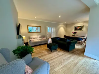 a living room with a couch and a table at Amulree, Edinburgh City in EDI