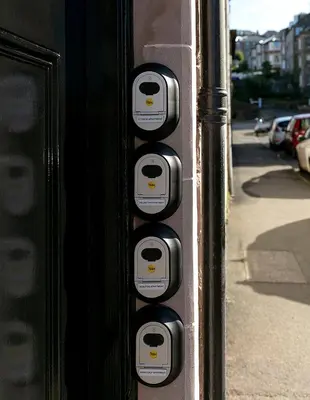 a parking meter on the side of a building at Castle Street Apartments - Luxury Scalpsie Apartment in Rothesay