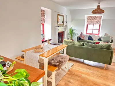 a living room with a couch and a table at Drymen View in Drymen