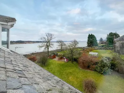 a view of the water from the roof of a house at Glengilp Apartment - Uk49317 in Ardrishaig