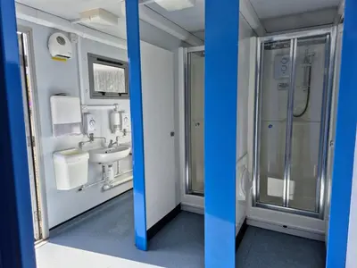 a bathroom with a sink and a shower at The Hideouts at Port nan Gael Campsite in Pennyghael