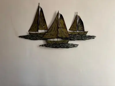 a wall decoration of three sailboats on a wall at Crescent Corner 44 Seamore Street 3 Bedroom in Largs