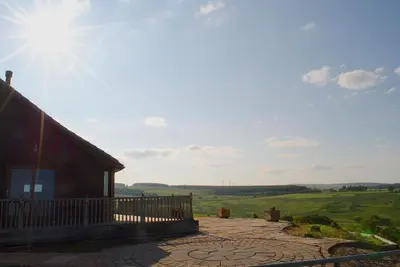 a house with a view of a green field at Auchenhill Lodge in Denny