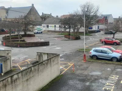 an aerial view of a parking lot with cars parked at Central 1-bed flat - Walk to shops, pubs and station in Saltcoats