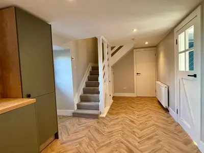 a hallway with stairs in a house at The Bothy, Callander in Callander