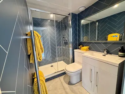 a bathroom with a toilet and a sink and a shower at The Bothy, Callander in Callander