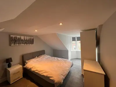 a bedroom with a bed in an attic at Our Salad Days Lochgilphead in Lochgilphead